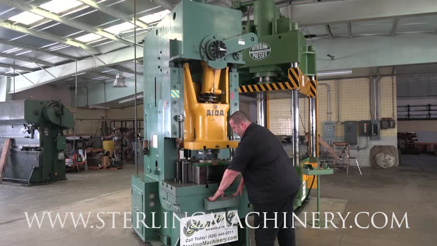 100 TON X 6" USED AIDA GAP FRAME PUNCH PRESS, MDL. PC-10 II, AIR CLUTCH AND BRAKE, T-SLOTTED RAM, ONE SHOT LUBE SYSTEM, DUAL PALM BUTTON CONTROL, FOOT PEDAL, T-SLOTTED BOLSTER, #A6165