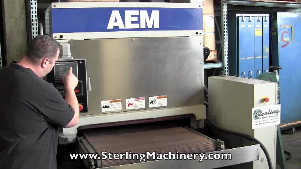 37\" Used AEM Wet Type Belt Grinder, Mdl. 401-37-HDMW,  Paper Filter Coolant System, Air Knife Dryer, Automatic Conveyor Belt Tracking, Stainless Steel Construction, PLC Controller (2000) #A1235